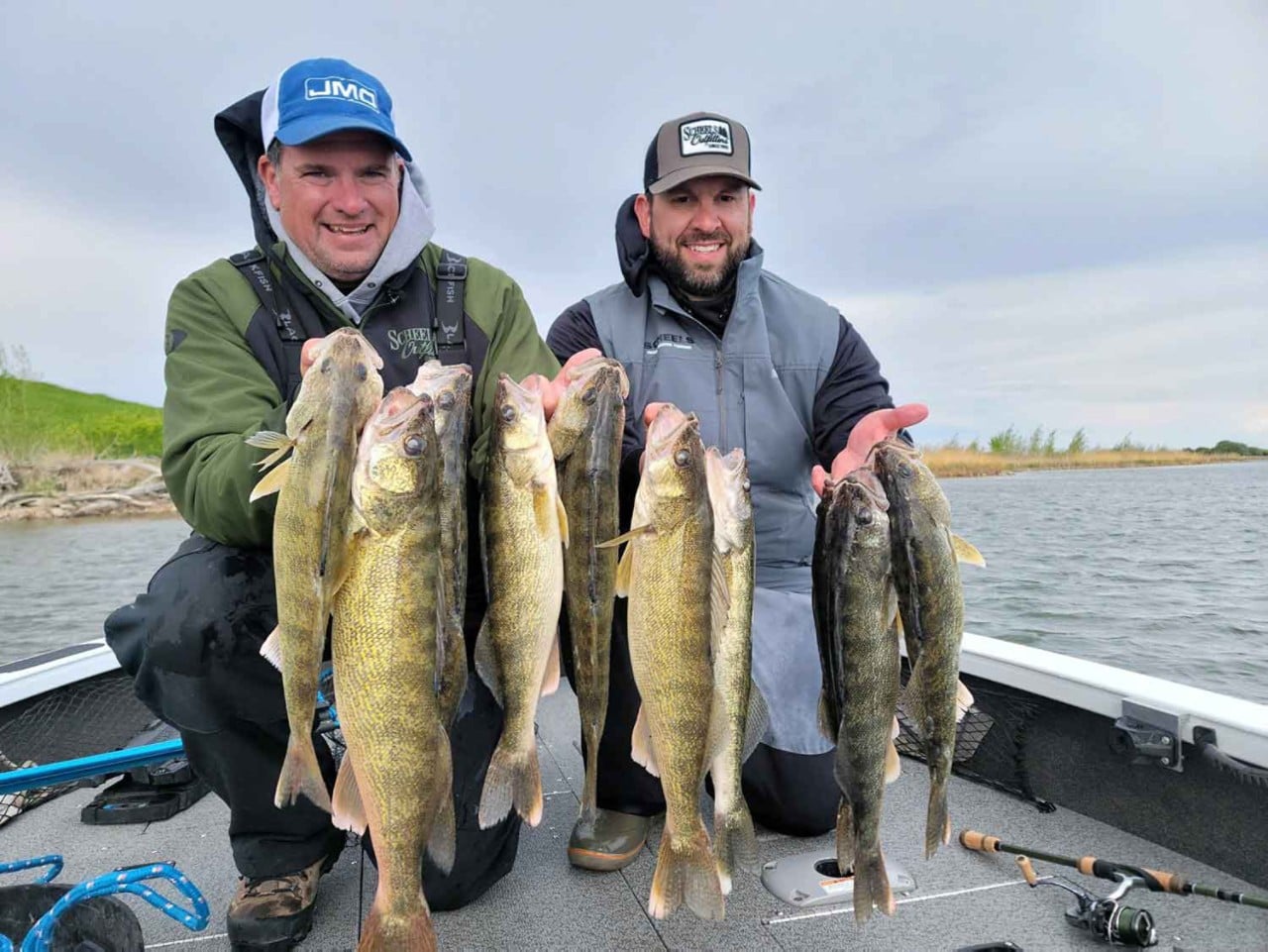 Jason Mitchell holding his walleye catch at Devil's Lake